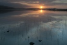 Sunrise over Benston Loch, Shetland
